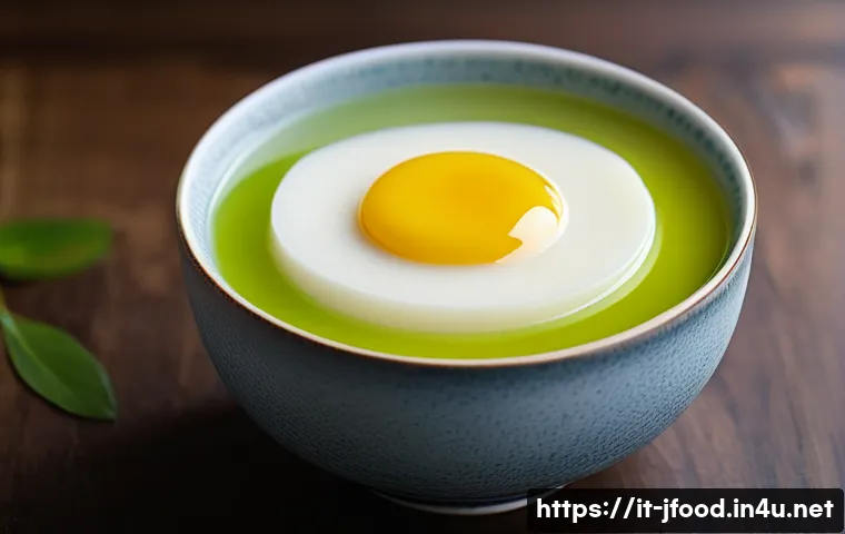 일본식 계란찜 만드는 법 - A serene close-up of a traditional Japanese tamago chawanmushi served in a delicate ceramic tea cup ...